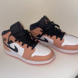 pink and black Nike retro 1s